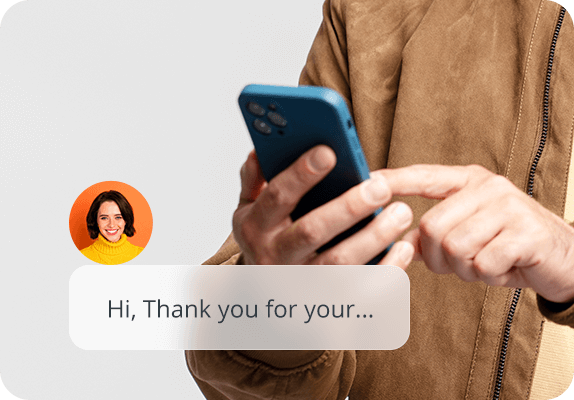 Image of Person in brown jacket texts on blue smartphone, using AI receptionist chat with woman's profile in yellow sweater.